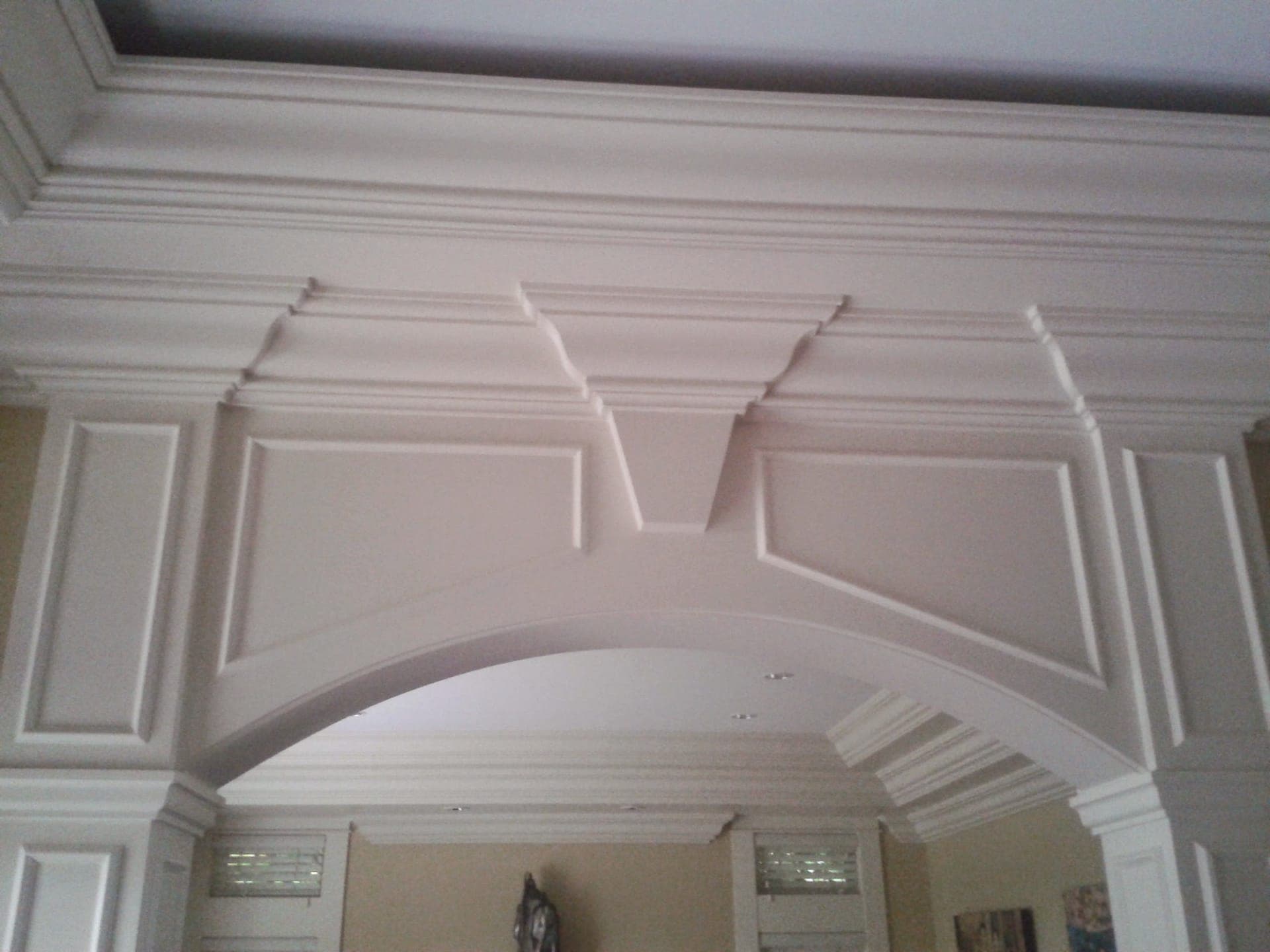 Custom archway with intricate moulding detail