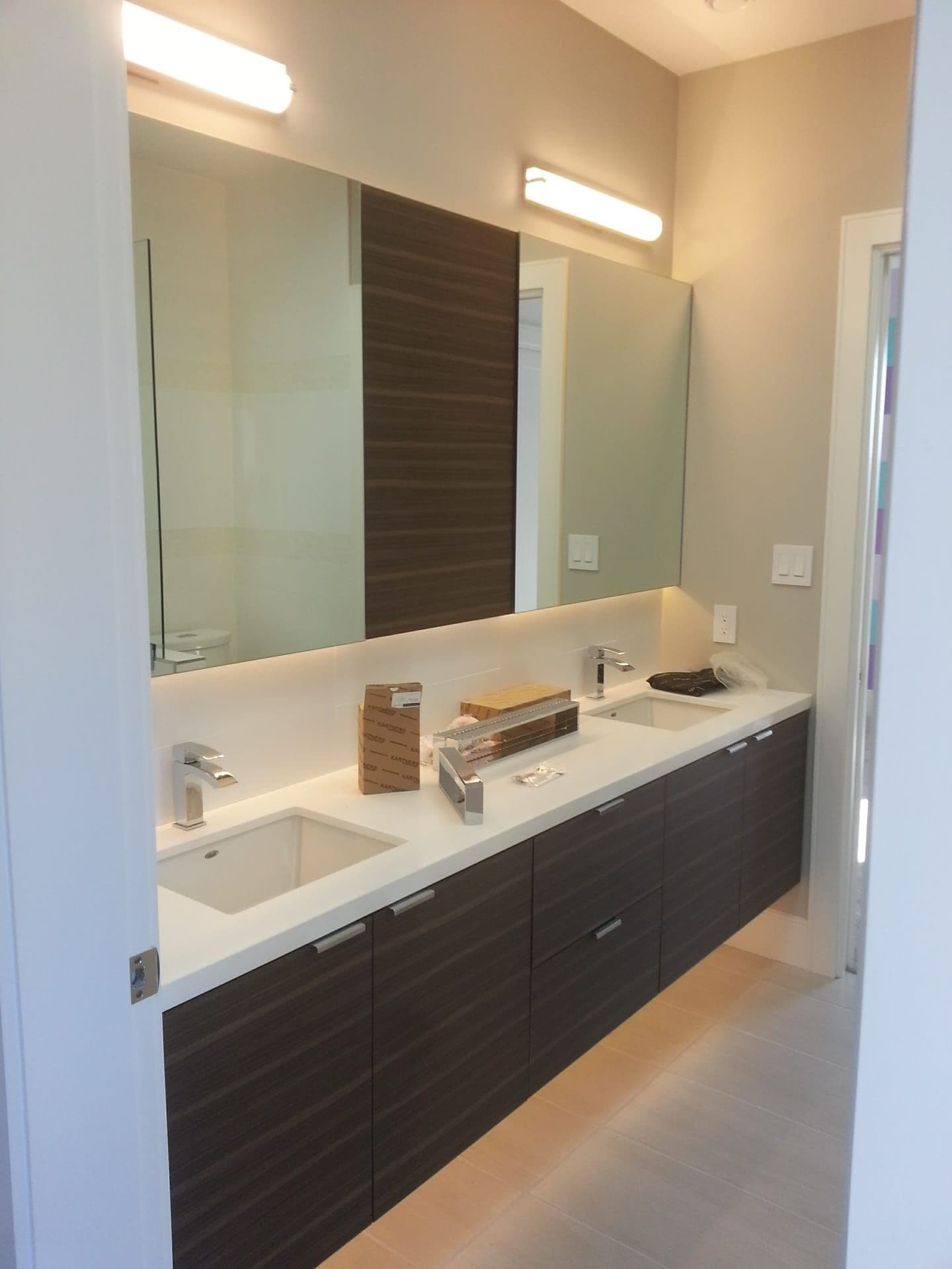 Modern bathroom with dark wood vanity and clean lines
