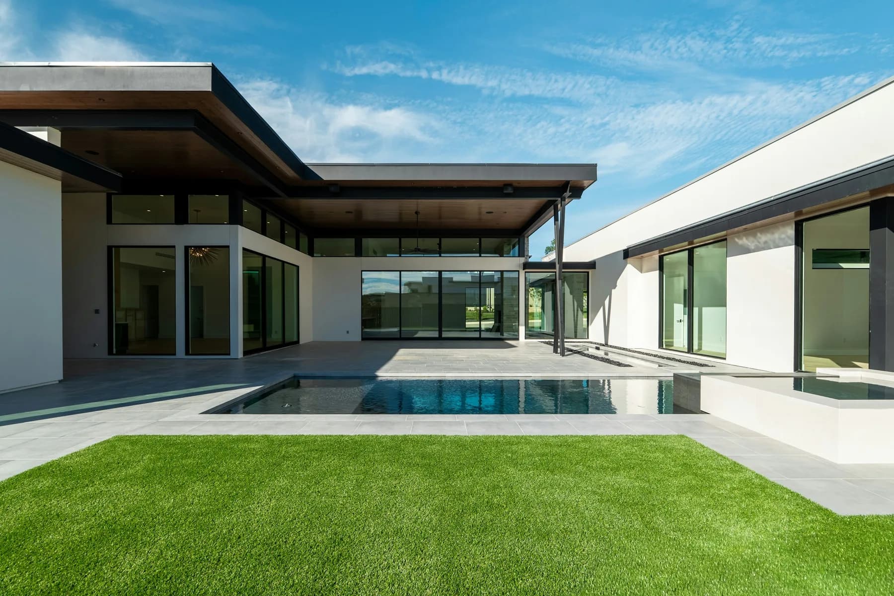 Side view of modern house showing terrace edge and pool